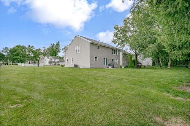 1860 Partridge Ln, Kalamazoo, MI 49009 - rear view of property with a lawn