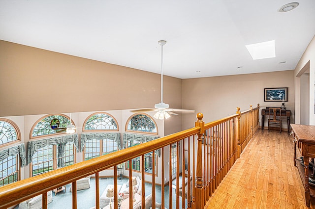 11683 Fair Lk, Delton, MI 49046 - hall featuring light wood-style flooring and a skylight