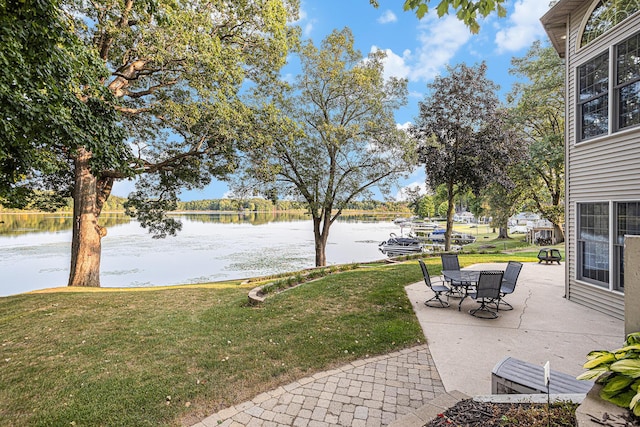 11683 Fair Lk, Delton, MI 49046 - view of grassy yard featuring a water view and a patio