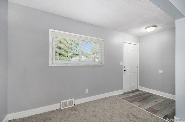 38 E Ypsilanti Ave, Southfield, MI 48340 - foyer featuring a textured ceiling and carpet flooring
