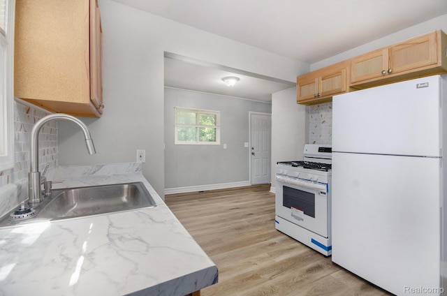 38 E Ypsilanti Ave, Southfield, MI 48340 - kitchen featuring white appliances, light brown cabinets, decorative backsplash, light wood finished floors, and light stone countertops