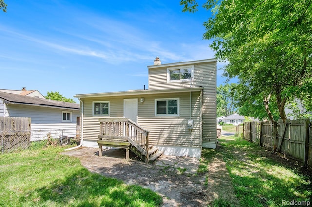 38 E Ypsilanti Ave, Southfield, MI 48340 - back of house featuring a chimney and a fenced backyard
