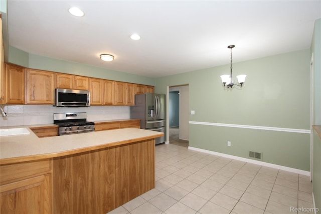 29716 Joy Rd, Livonia, MI 48150 - kitchen featuring stainless steel appliances, a chandelier, light countertops, a peninsula, and decorative light fixtures