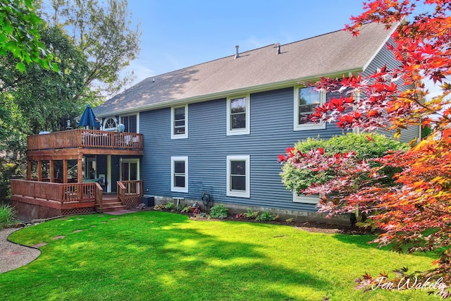 278 Caravan Rd, Norton Shores, MI 49441 - back of house featuring a wooden deck, a yard, and a shingled roof