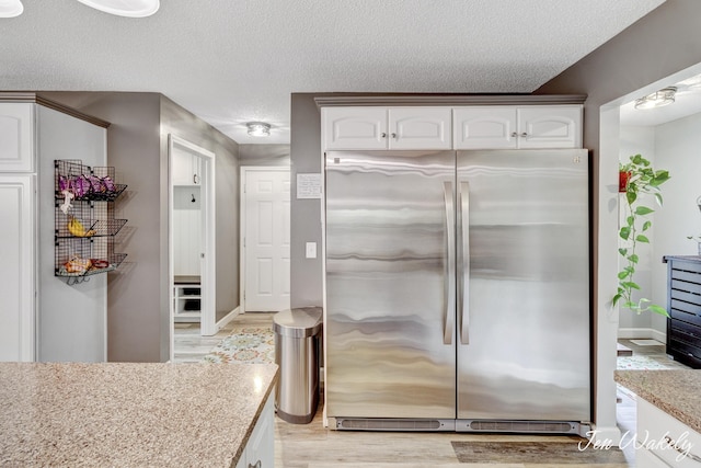 278 Caravan Rd, Norton Shores, MI 49441 - bathroom featuring wood finished floors and a textured ceiling