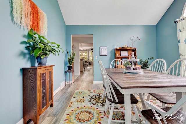 278 Caravan Rd, Norton Shores, MI 49441 - dining space with vaulted ceiling and light wood-type flooring