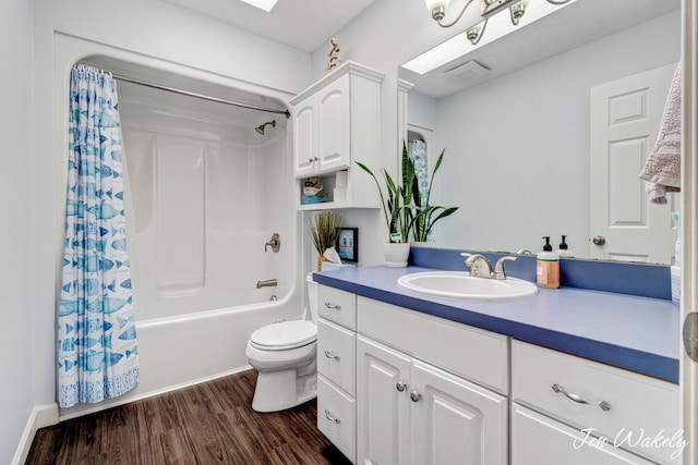 278 Caravan Rd, Norton Shores, MI 49441 - bathroom featuring wood finished floors, vanity, and shower / bath combo