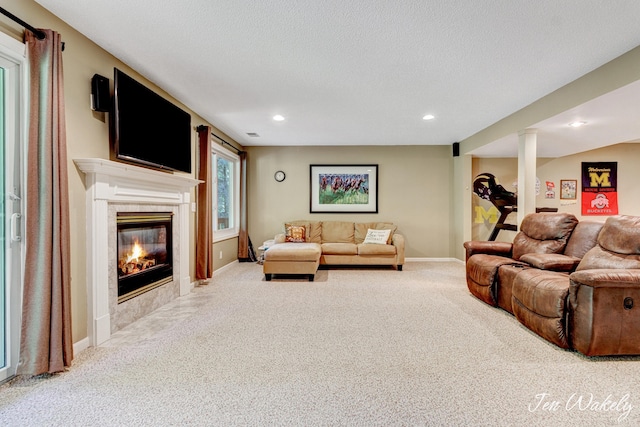 278 Caravan Rd, Norton Shores, MI 49441 - living area featuring carpet flooring, a tiled fireplace, recessed lighting, and a textured ceiling