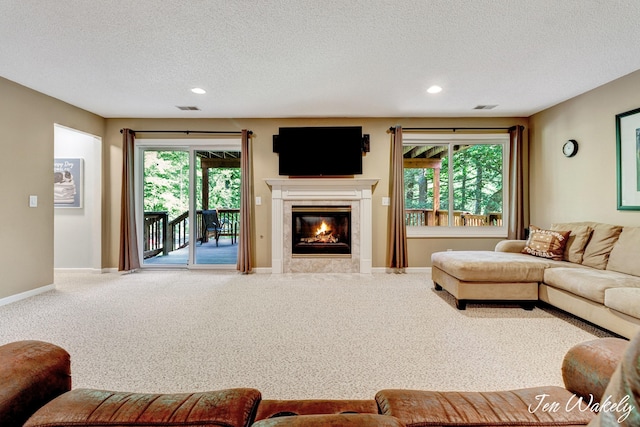 278 Caravan Rd, Norton Shores, MI 49441 - carpeted living area with a textured ceiling, recessed lighting, and a fireplace