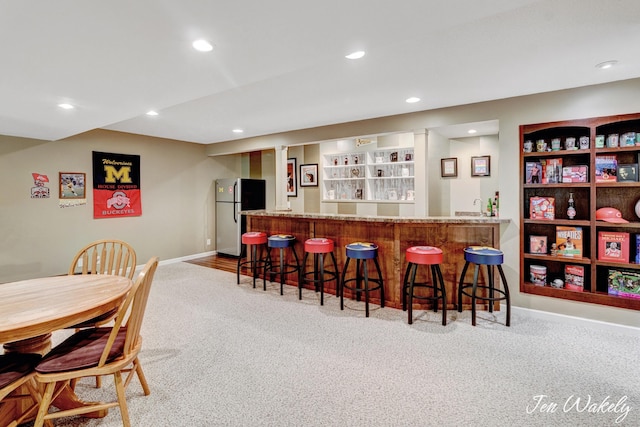 278 Caravan Rd, Norton Shores, MI 49441 - indoor bar featuring freestanding refrigerator, carpet floors, and recessed lighting