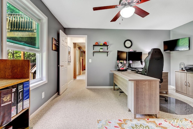 278 Caravan Rd, Norton Shores, MI 49441 - carpeted home office featuring ceiling fan and baseboards