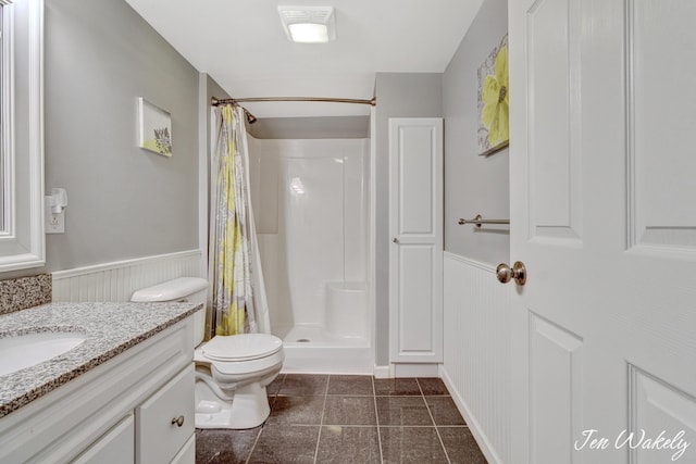 278 Caravan Rd, Norton Shores, MI 49441 - full bath featuring a wainscoted wall, vanity, curtained shower, tile patterned flooring, and a decorative wall