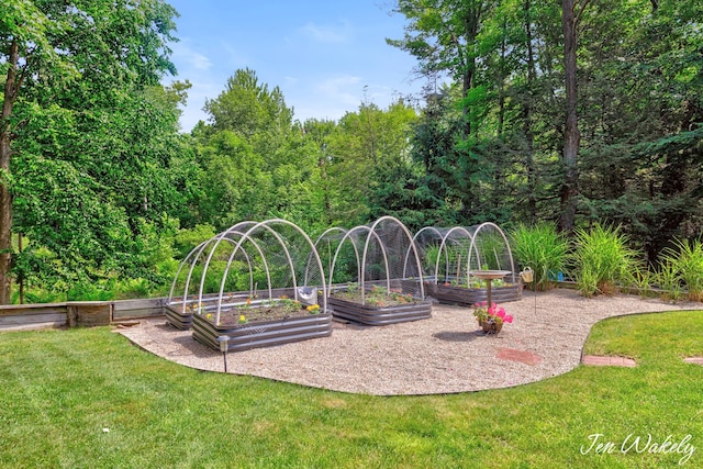 278 Caravan Rd, Norton Shores, MI 49441 - view of play area with a garden and a lawn