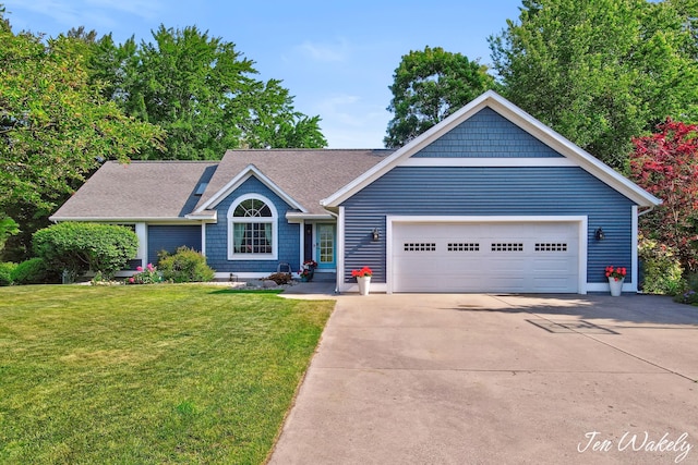 278 Caravan Rd, Norton Shores, MI 49441 - view of front of home featuring concrete driveway, a front lawn, roof with shingles, and an attached garage