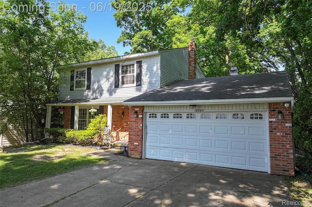 12260 Dollar Lake Dr, Fenton, MI 48430 - traditional-style house featuring brick siding, concrete driveway, a chimney, and an attached garage