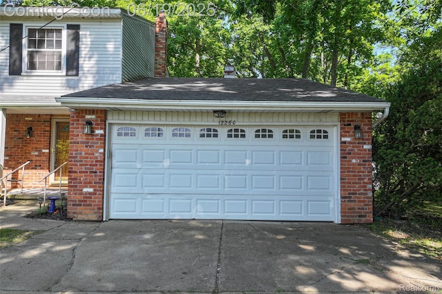 12260 Dollar Lake Dr, Fenton, MI 48430 - garage with concrete driveway