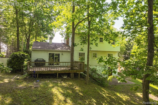 12260 Dollar Lake Dr, Fenton, MI 48430 - back of house featuring a wooden deck and a chimney