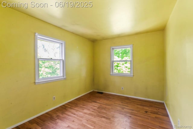 12260 Dollar Lake Dr, Fenton, MI 48430 - empty room featuring wood finished floors and baseboards