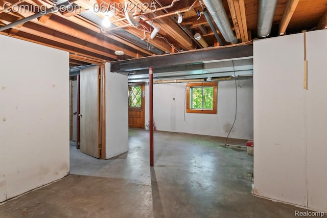 12260 Dollar Lake Dr, Fenton, MI 48430 - below grade area with freestanding refrigerator