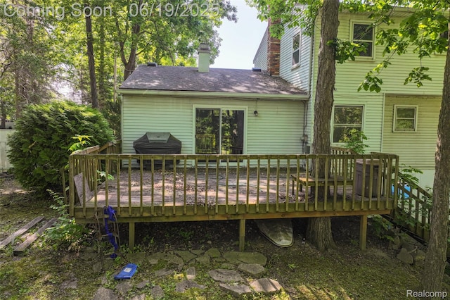 12260 Dollar Lake Dr, Fenton, MI 48430 - rear view of house with a chimney and a deck