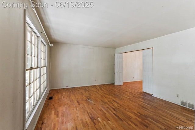 12260 Dollar Lake Dr, Fenton, MI 48430 - empty room with wood finished floors