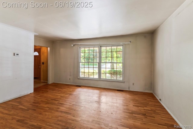 12260 Dollar Lake Dr, Fenton, MI 48430 - spare room featuring wood finished floors