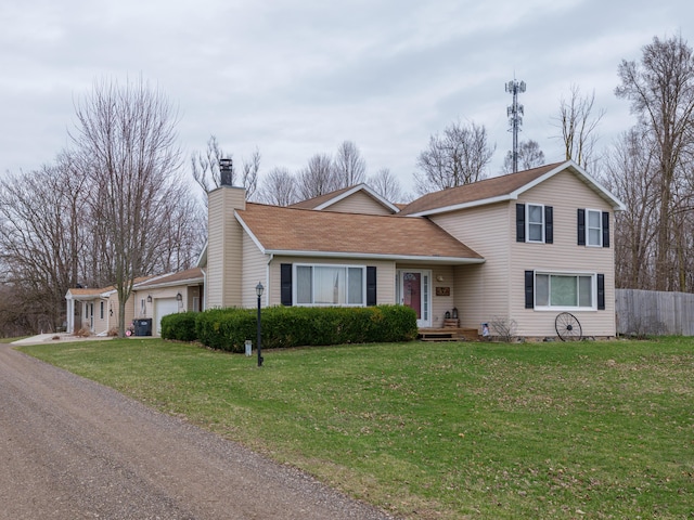 8368 N 46th St, Augusta, MI 49012 - view of front facade with a chimney, an attached garage, and roof with shingles