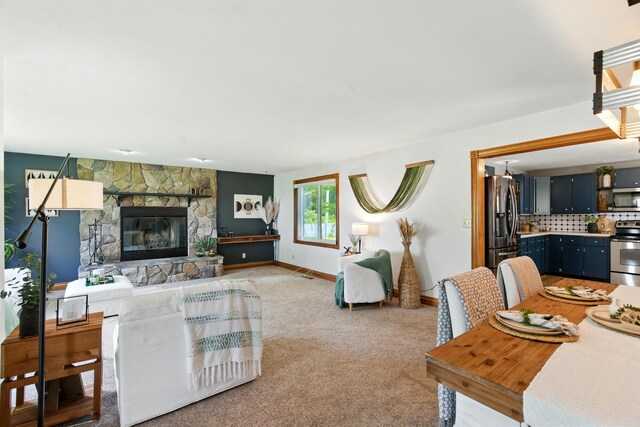 8368 N 46th St, Augusta, MI 49012 - living room featuring a fireplace and light colored carpet