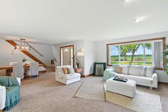 8368 N 46th St, Augusta, MI 49012 - living room featuring stairs and carpet floors