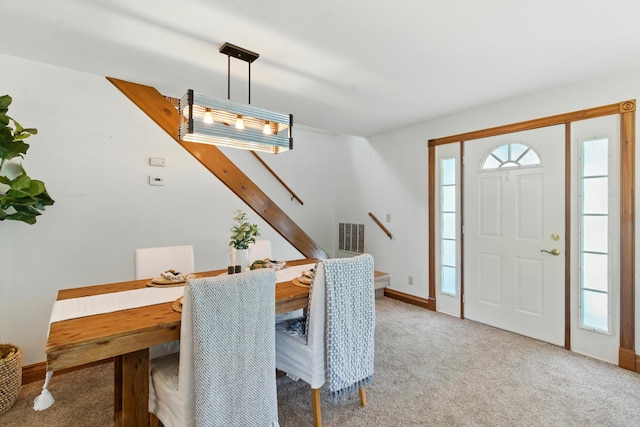8368 N 46th St, Augusta, MI 49012 - dining room featuring stairway and light colored carpet