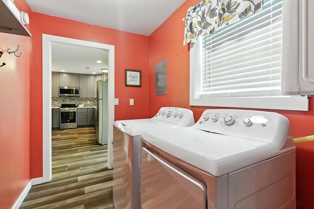 8368 N 46th St, Augusta, MI 49012 - laundry area featuring dark wood-style floors, washer and dryer, and electric panel