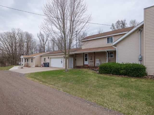 8368 N 46th St, Augusta, MI 49012 - view of front of property featuring a porch, a garage, concrete driveway, a front lawn, and a chimney