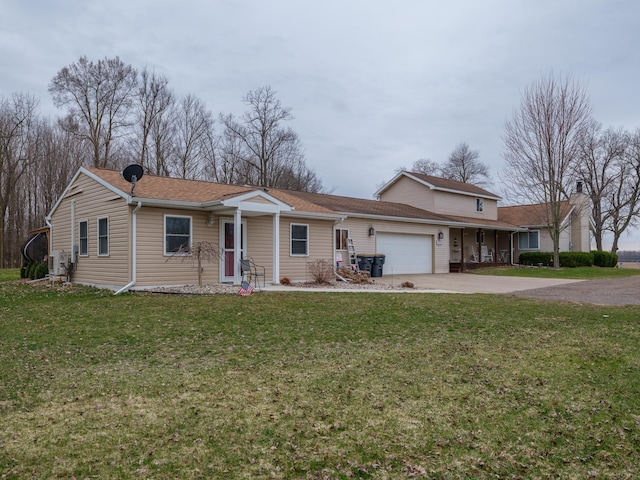 8368 N 46th St, Augusta, MI 49012 - view of front of home with an attached garage, driveway, a front lawn, and a shingled roof