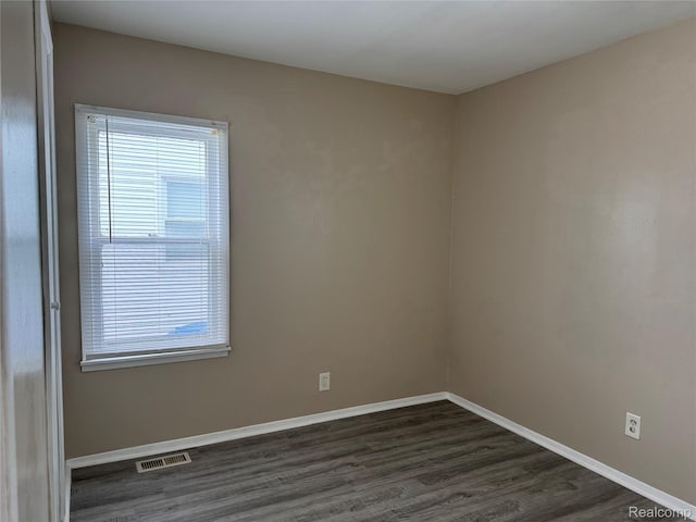 11236 Studebaker Ave, Warren, MI 48089 - unfurnished room with dark wood-style flooring and baseboards