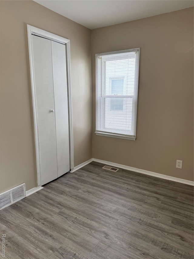 11236 Studebaker Ave, Warren, MI 48089 - unfurnished bedroom featuring wood finished floors and a closet