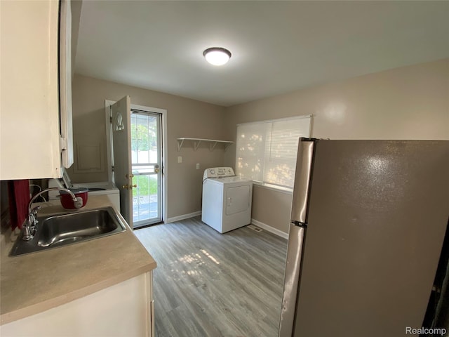 11236 Studebaker Ave, Warren, MI 48089 - laundry area featuring washer / dryer and light wood-style floors