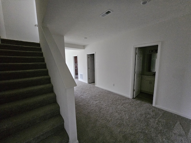 8781 Prairie Stone Dr SW, Byron Center, MI 49315 - stairway featuring carpet and baseboards