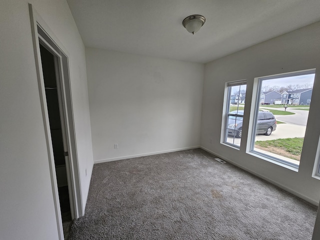 8781 Prairie Stone Dr SW, Byron Center, MI 49315 - carpeted empty room with baseboards