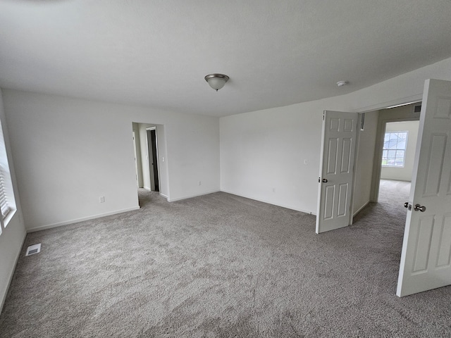 8781 Prairie Stone Dr SW, Byron Center, MI 49315 - carpeted spare room featuring baseboards and a smoke detector
