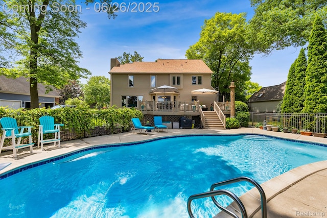 5520 Huron Hills Dr, Commerce Twp, MI 48382 - view of pool with a wooden deck, a patio area, and stairway
