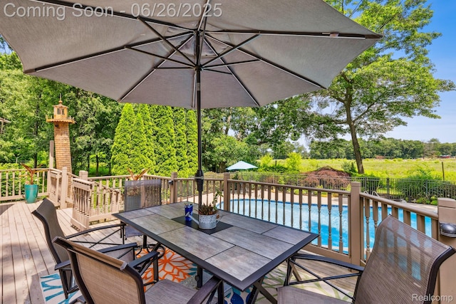 5520 Huron Hills Dr, Commerce Twp, MI 48382 - wooden terrace featuring outdoor dining space and view of scattered trees