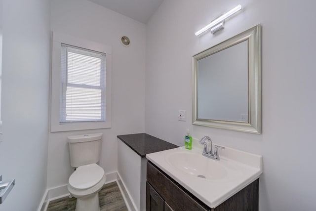 28 E Southern Ave, Muskegon, MI 49442 - half bathroom with vanity and wood finished floors