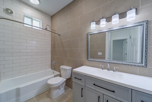 28 E Southern Ave, Muskegon, MI 49442 - bathroom featuring shower / bathtub combination, vanity, tile walls, and tile patterned flooring