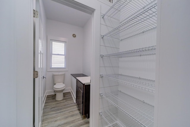 28 E Southern Ave, Muskegon, MI 49442 - bathroom with wood finished floors and vanity