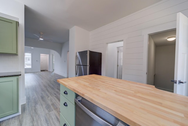 28 E Southern Ave, Muskegon, MI 49442 - kitchen featuring green cabinetry, appliances with stainless steel finishes, wood counters, a ceiling fan, and light wood-style flooring