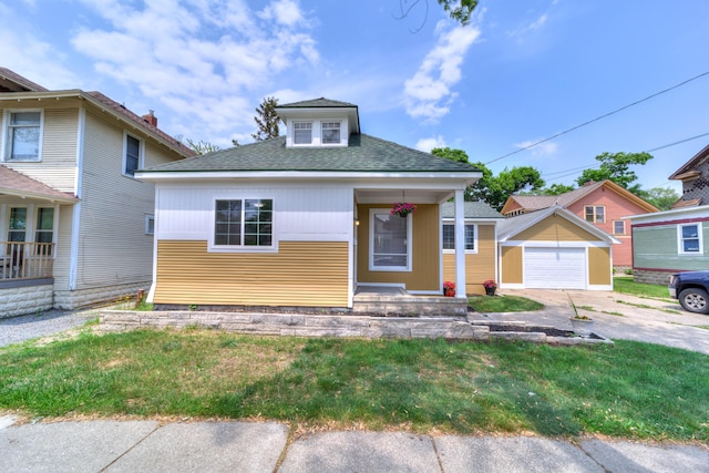 28 E Southern Ave, Muskegon, MI 49442 - bungalow-style home featuring a garage, an outdoor structure, a shingled roof, covered porch, and concrete driveway