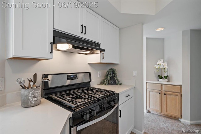2755 Royal Ave, Berkley, MI 48072 - kitchen with stainless steel gas stove, under cabinet range hood, light countertops, white cabinets, and recessed lighting