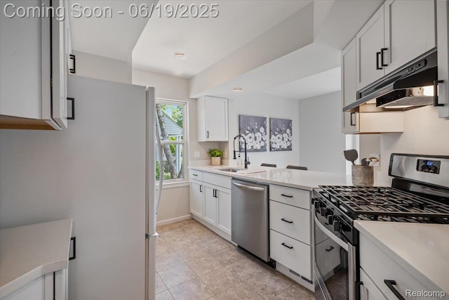 2755 Royal Ave, Berkley, MI 48072 - kitchen featuring stainless steel appliances, under cabinet range hood, white cabinets, and light countertops