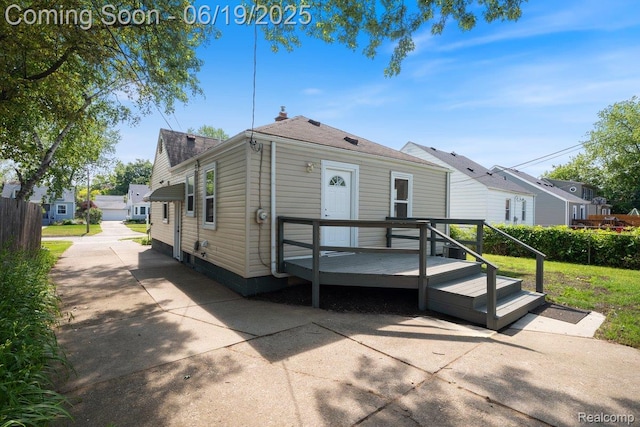 2755 Royal Ave, Berkley, MI 48072 - shotgun-style home with a deck and a patio