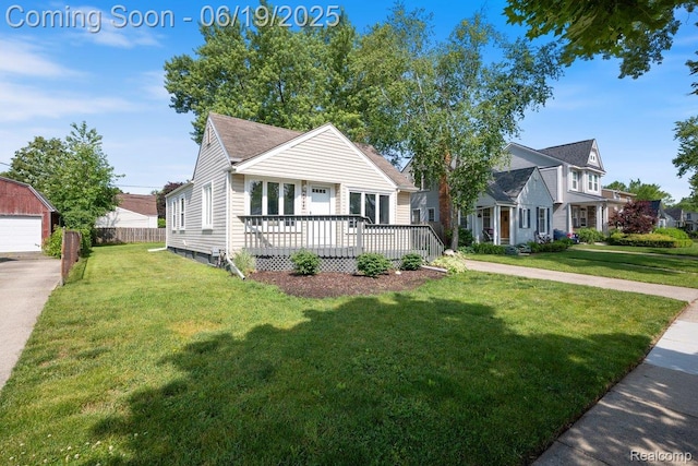 2755 Royal Ave, Berkley, MI 48072 - view of front of home with a wooden deck, an outdoor structure, and a shingled roof